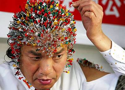 10 More Bizarre World Records 2. Most Needles Inserted on the Head 10 More Bizarre World Records