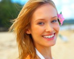 Fashion shot of beautiful blonde woman on the beach in Hawaii