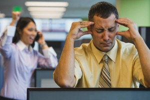 Businessman Irritated with Loud Coworker