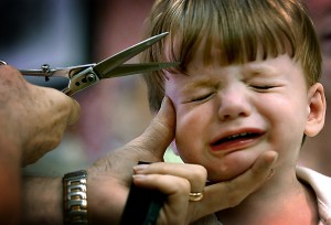 In August 2007 Patrick Corbett, who will be two year-old in September, managed to not cry during his hair cut at Gennuso's barber Shop, until Barber Garry Oster went for the bangs. (Monica Lopossay/Baltimore Sun)