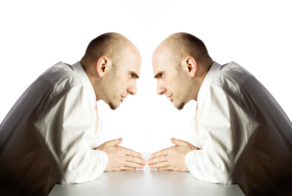 Double portrait  of a businessman facing himself