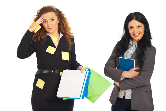 Disorganized business women with folders and reminder notes on her suit and organized smiling business woman holding personal agenda isolated on white background